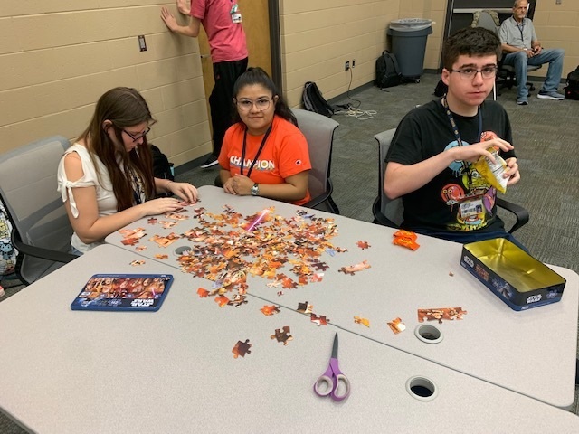 students doing a puzzle