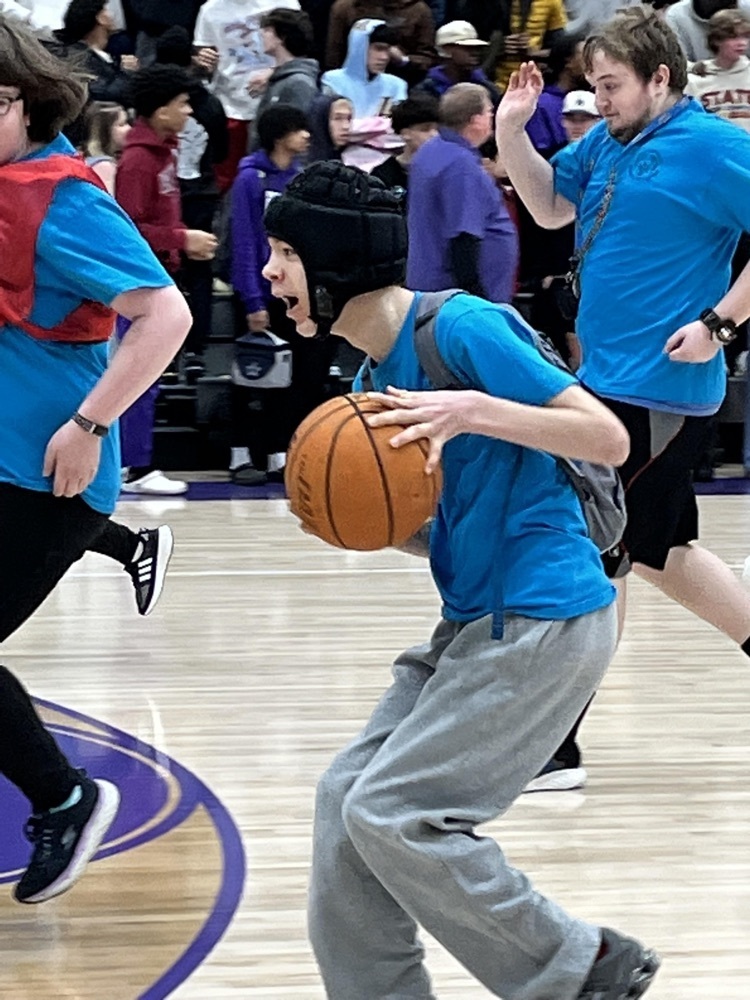 west student playing basketball